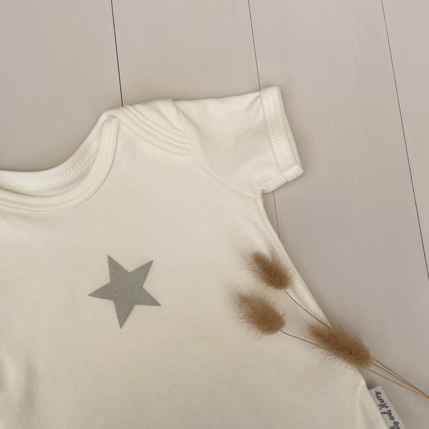 milk white single grey star baby grow with dried dried pampas bunny tails