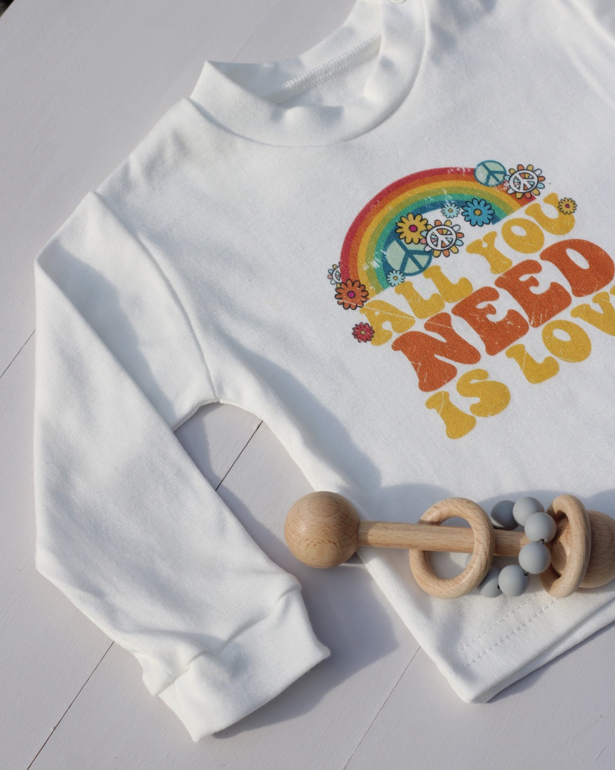 Retro All You Need Is Love Baby Top With Long Sleeves in White