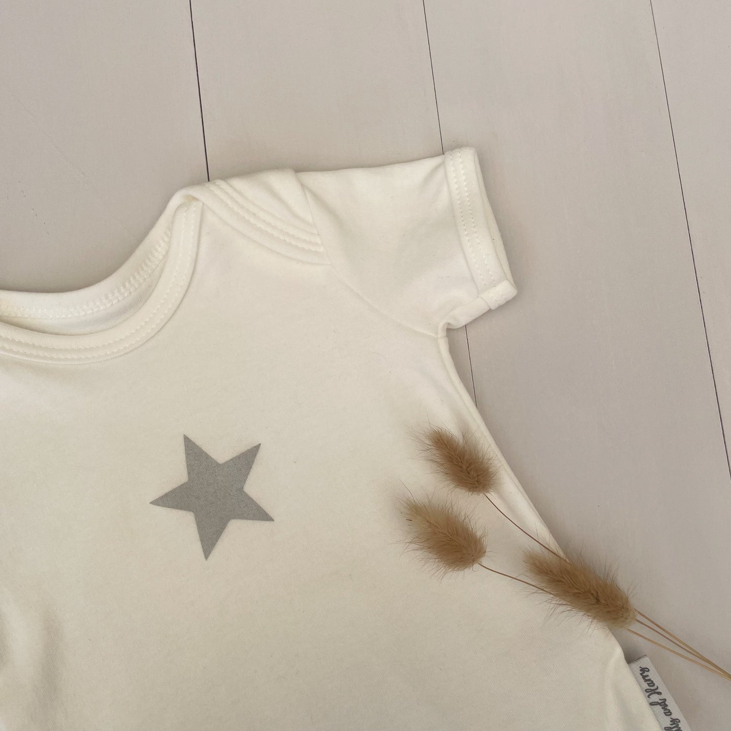 milk white single grey star baby grow with dried dried pampas bunny tails 