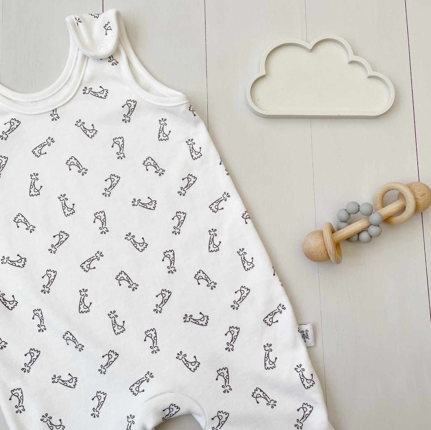 white romper dungarees for baby with giraffe prints - super soft 100% organic cotton - uk made - London business - gift box availabe